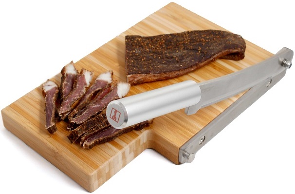 PLEASE NOTE: Clearance Stock - Limited Stock Available, first come first serve. BILTONG South African Tradition. Finest quality stainless steel blade. Cuts in a shearing action against a precision machined stainless steel guide. Anti-bacterial, eco-friendly bamboo base for maximum hygiene. Stylish bamboo base fitted with non-slip super-grip pads for safety. Simple and highly efficient, great for slicing meat, biltong, herbs, vegetables and other food-stuffs Stylish, elegant and attractive in any kitchen or bar RV2994 - UltraTech Biltong-Pro Premium Bamboo Shear-Action Cutter UltraTech Biltong-Pro Bamboo Shear-Action Cutter.