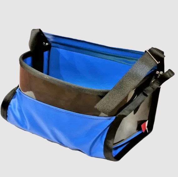 The SP20 is a 20-liter PVC bag featuring a padded design and an open bottom, equipped with a comfortable shoulder sling for easy carrying. It also includes a hard HDPE face for added durability and protection, making it a practical and robust choice for everyday use.