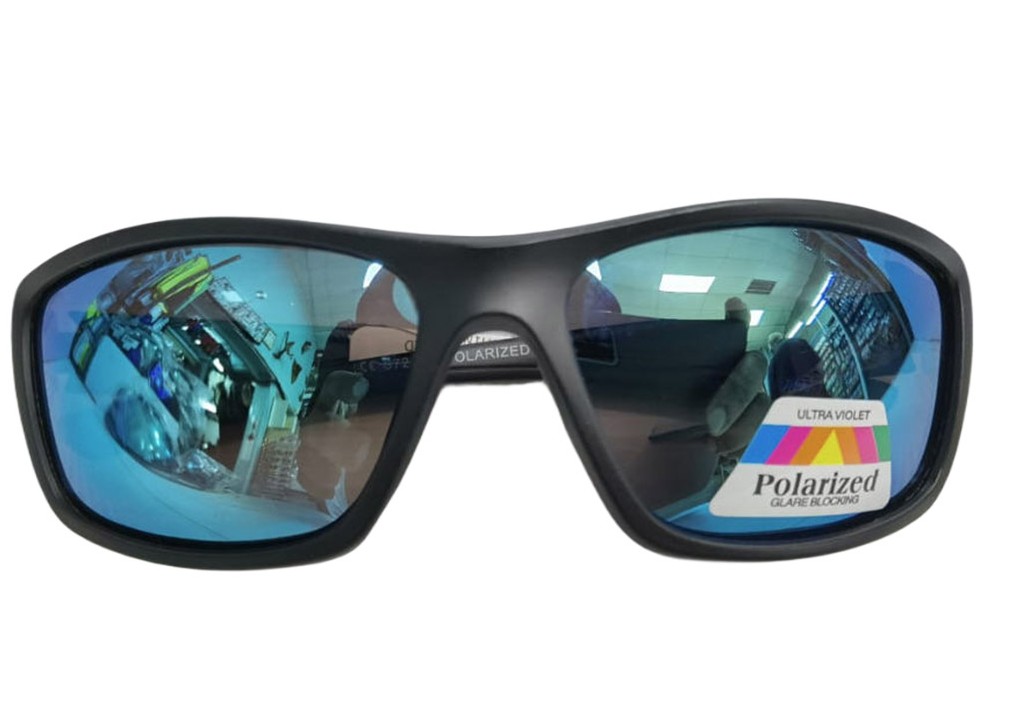 The Raptor sunglasses feature a sleek, shiny finish with polarized lenses designed to reduce glare and enhance visual clarity. They come in a stylish smoke black color and have a non-rubberized frame, giving them a smooth and polished look.