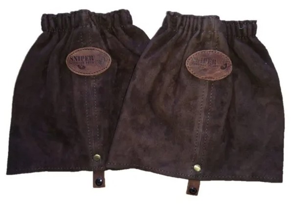The tapered leather gaiter is designed for a secure and comfortable fit, featuring convenient hook-and-loop fastenings and durable pop studs for easy wear and adjustment. Its elasticated construction allows it to adapt to different leg sizes, providing a one-size-fits-all solution while ensuring a snug and reliable fit during outdoor activities.