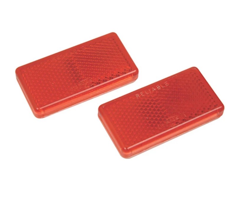 Oblong red reflectors sold as a pair, featuring a strong self-adhesive backing for simple, secure mounting.